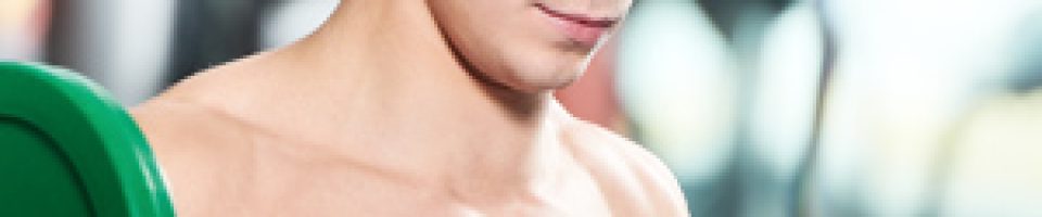 A man is holding a barbell in his hands